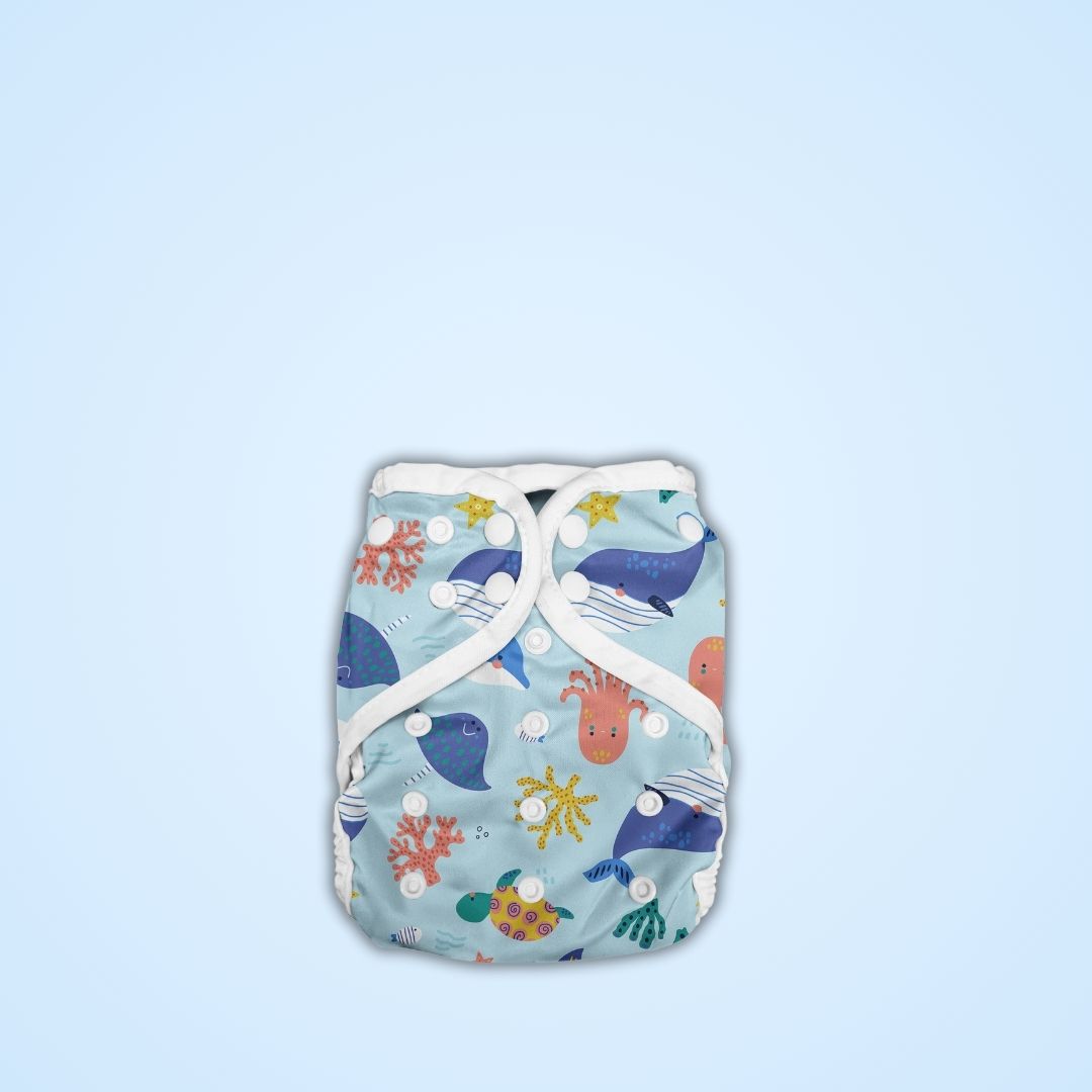 Baby diaper with ocean-themed print